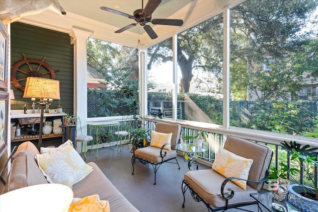 sunroom / solarium with ceiling fan