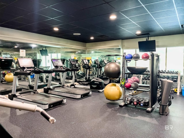 workout area featuring a drop ceiling