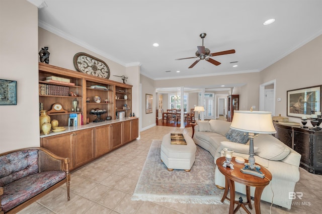 tiled living room featuring ceiling fan and ornamental molding