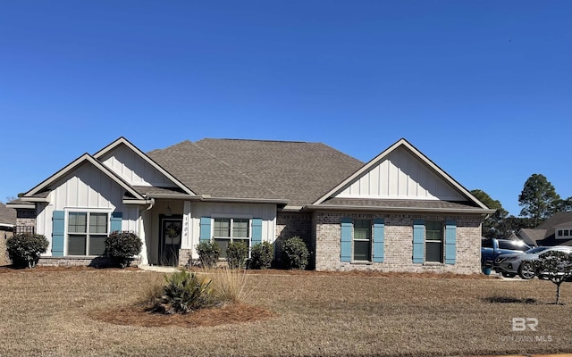 craftsman-style home with a front yard