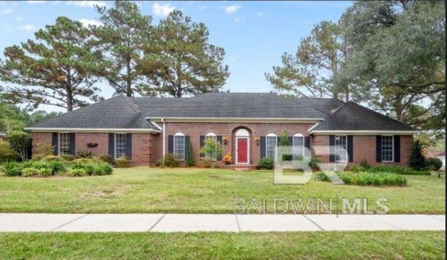 ranch-style home with a front yard