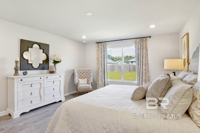 bedroom featuring baseboards, recessed lighting, and light wood finished floors