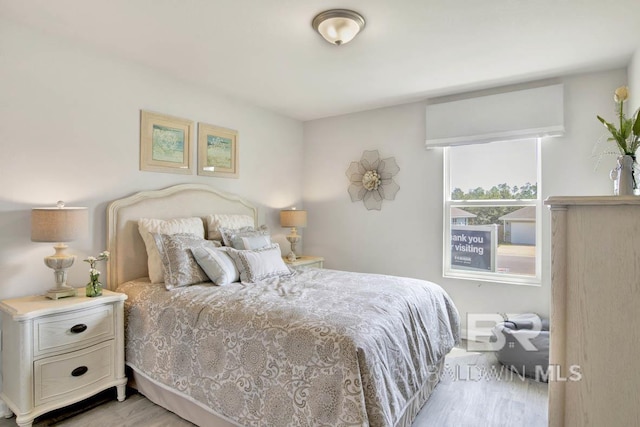 bedroom featuring light wood-type flooring