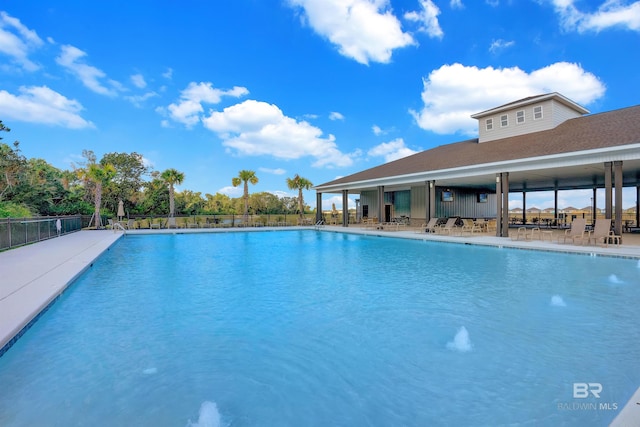 pool featuring a patio area and fence