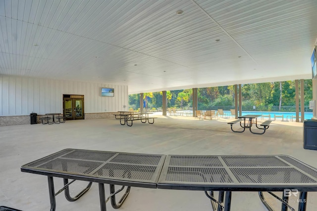 exterior space with a community pool and french doors