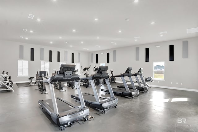 workout area featuring baseboards, visible vents, and recessed lighting