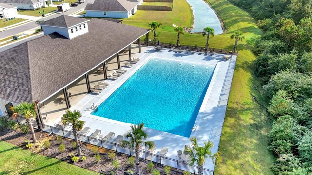 pool featuring fence and a patio area