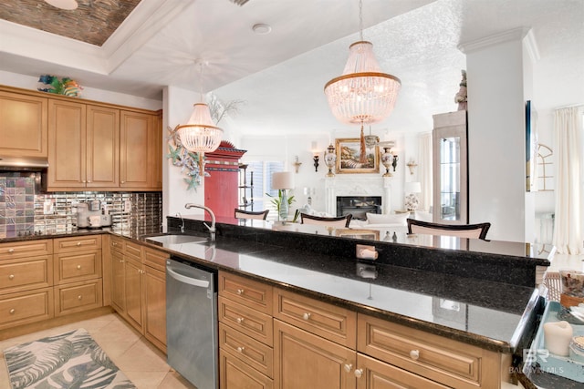 kitchen featuring dark stone counters, dishwasher, a chandelier, and decorative light fixtures