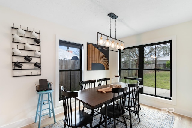 5100 Pine Way, Orange Beach, AL 36561 - dining room featuring wood finished floors and baseboards