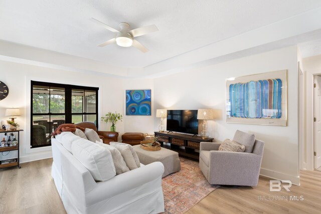 5100 Pine Way, Orange Beach, AL 36561 - living area featuring baseboards, a ceiling fan, and light wood-style floors