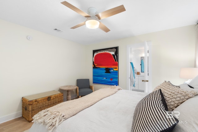 5100 Pine Way, Orange Beach, AL 36561 - bedroom with wood finished floors, connected bathroom, ceiling fan, baseboards, and visible vents