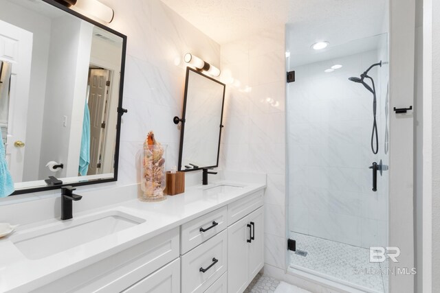 5100 Pine Way, Orange Beach, AL 36561 - full bath with double vanity, a shower stall, and a sink