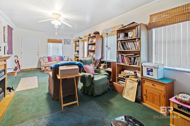 living room with carpet floors, crown molding, and ceiling fan