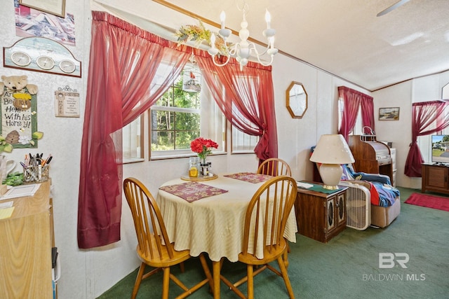 carpeted dining room with a textured ceiling, vaulted ceiling, and a chandelier