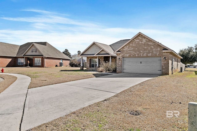 view of front of property featuring a garage and a front lawn