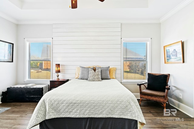 bedroom featuring ornamental molding, hardwood / wood-style floors, and ceiling fan