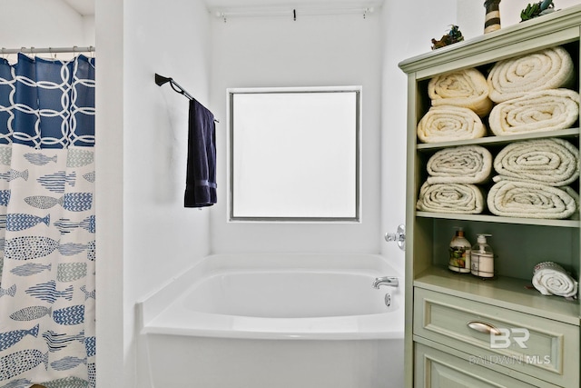 bathroom featuring shower with separate bathtub