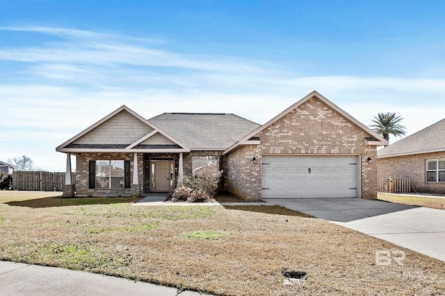 view of front of home with a garage and a front lawn