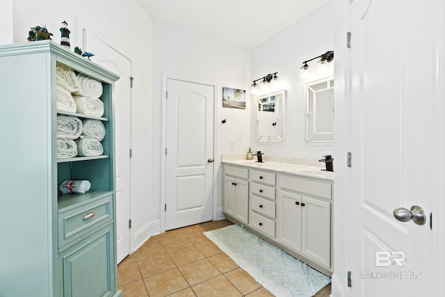 bathroom with tile patterned flooring and vanity