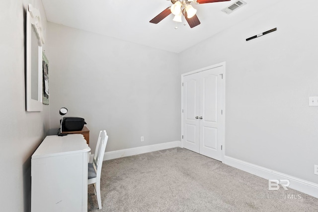 office space featuring light colored carpet and ceiling fan