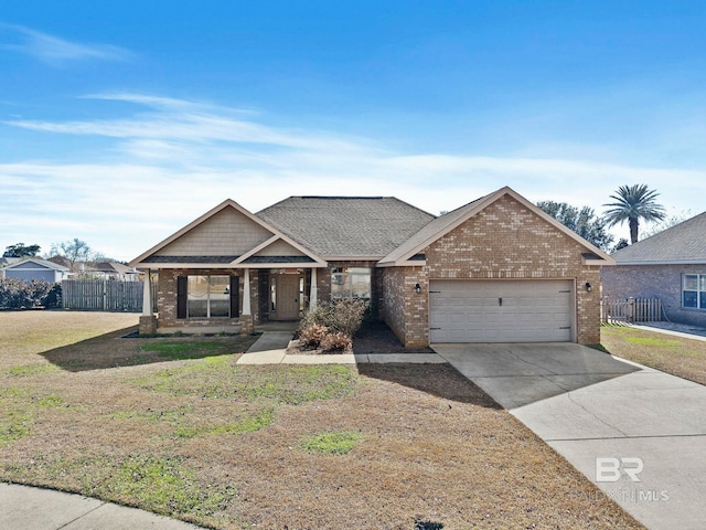 view of front of house featuring a garage and a front lawn