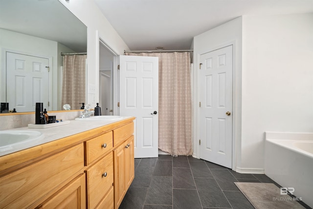 bathroom with tile patterned flooring, a sink, a washtub, and double vanity