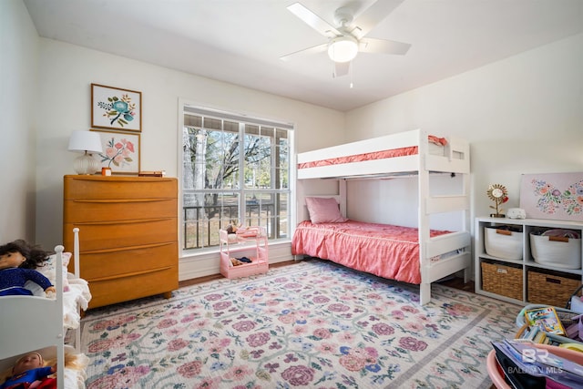 bedroom with a ceiling fan and wood finished floors