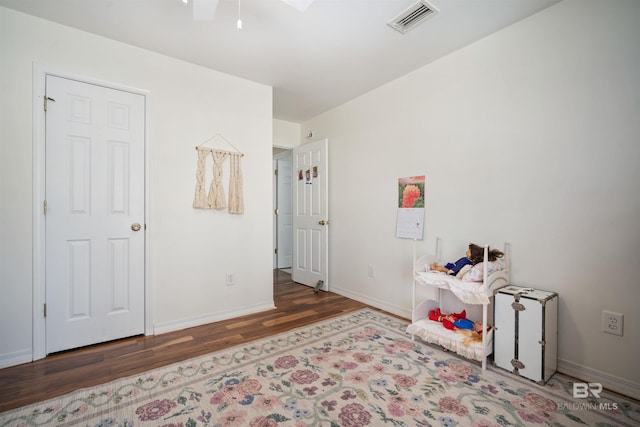 interior space featuring wood finished floors, visible vents, and baseboards