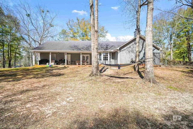 back of house with a patio and fence