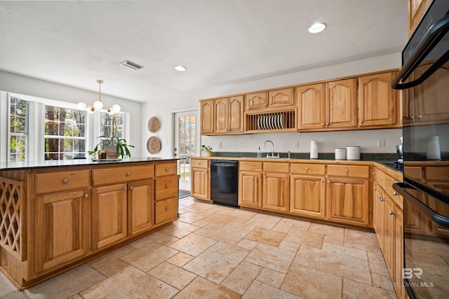 kitchen with recessed lighting, visible vents, black appliances, and stone tile flooring