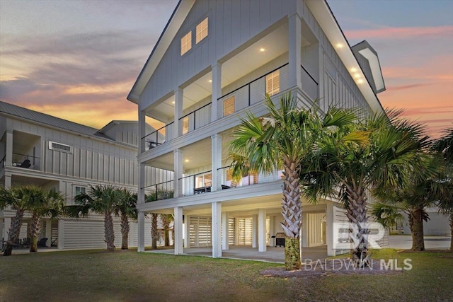 view of back of house at dusk