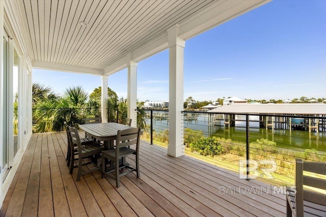 wooden deck featuring a water view