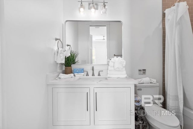 bathroom with vanity and toilet