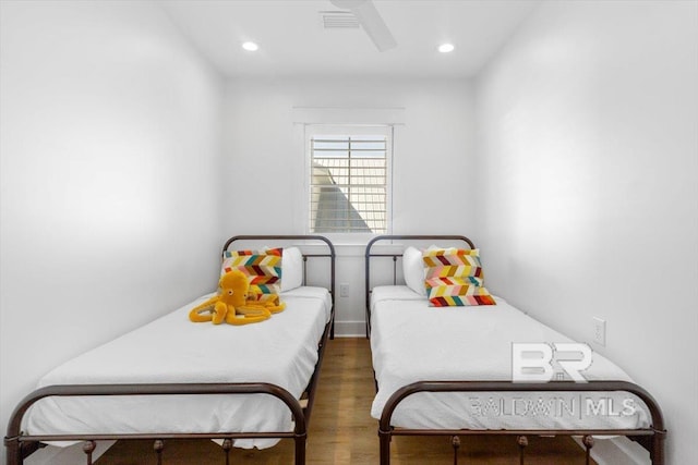 bedroom with visible vents, recessed lighting, and wood finished floors