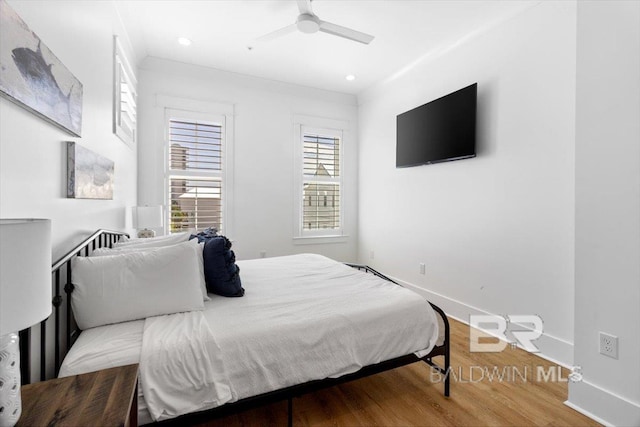 bedroom featuring recessed lighting, wood finished floors, and baseboards