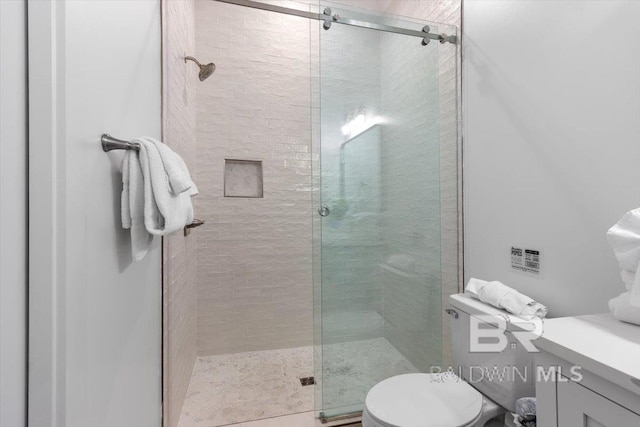 full bath with a shower stall and toilet