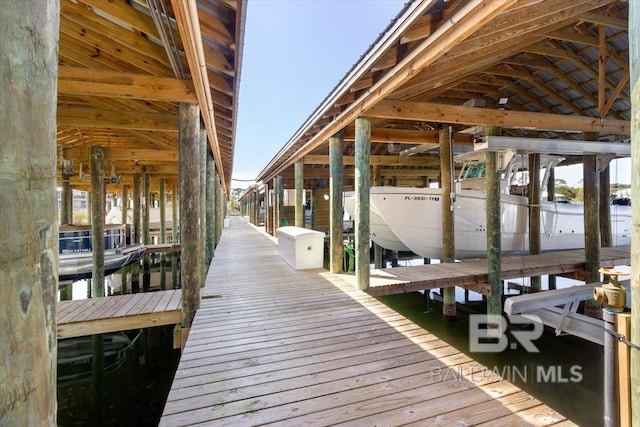 view of dock featuring a water view and boat lift