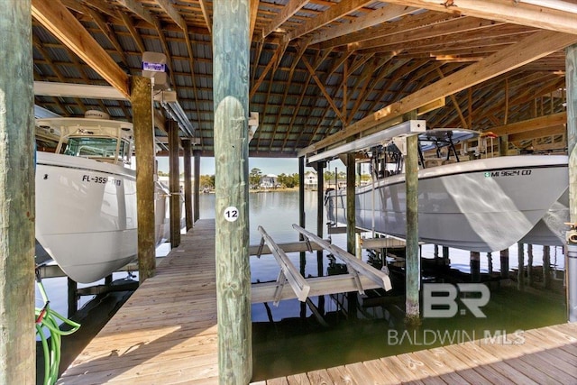 view of dock featuring a water view and boat lift