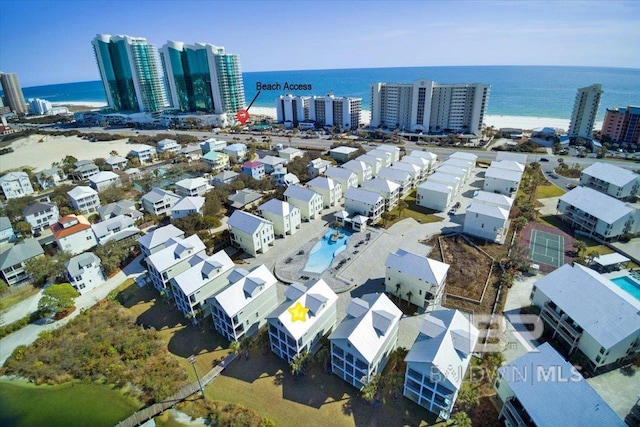 bird's eye view featuring a water view and a city view