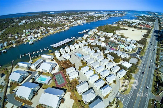 drone / aerial view featuring a water view and a residential view