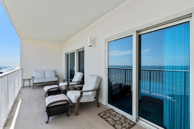 balcony featuring a water view