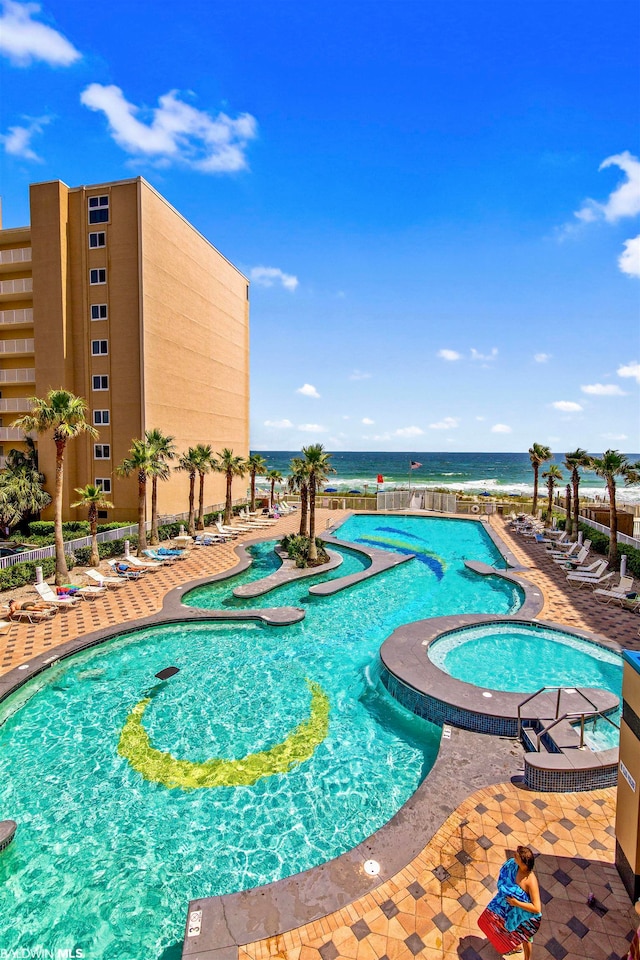 view of pool with a community hot tub and a patio