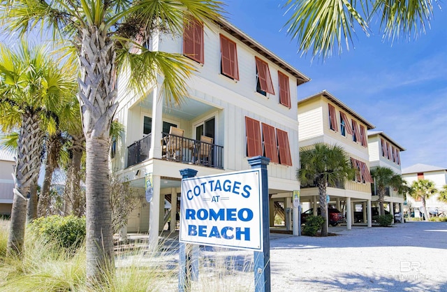 487 E 1st Ave Unit F, Gulf Shores, AL 36542 - community / neighborhood sign featuring a carport