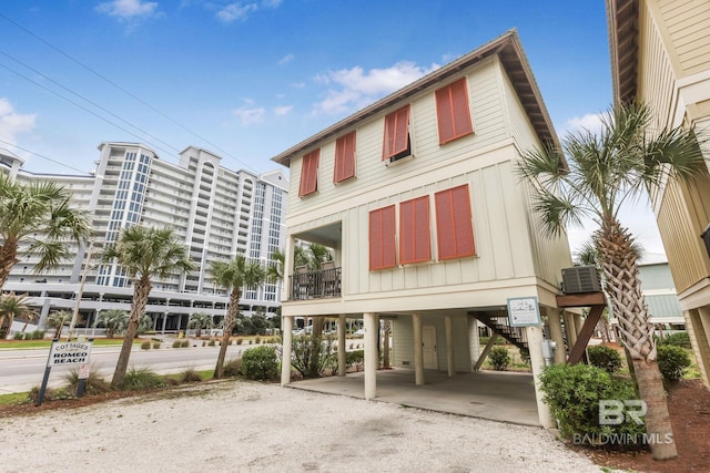 487 E 1st Ave Unit F, Gulf Shores, AL 36542 - view of property with a carport and driveway