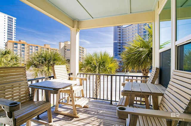 487 E 1st Ave Unit F, Gulf Shores, AL 36542 - wooden terrace with a city view