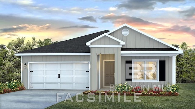 view of front of house with a garage and a lawn