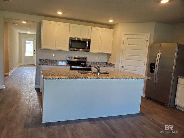 kitchen featuring white cabinets, sink, a kitchen island with sink, and appliances with stainless steel finishes