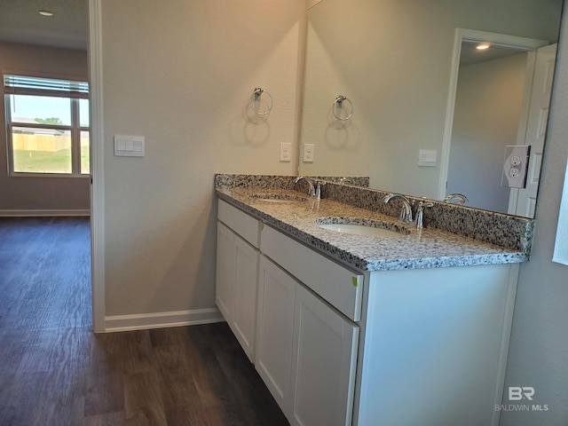 bathroom featuring hardwood / wood-style floors and vanity