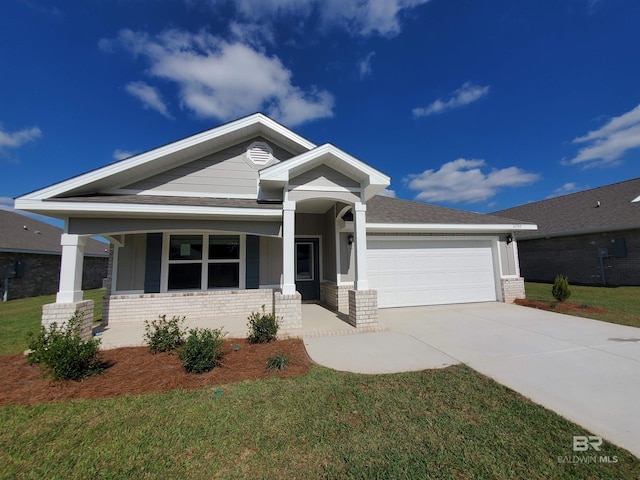 craftsman house featuring a front lawn, a porch, and a garage