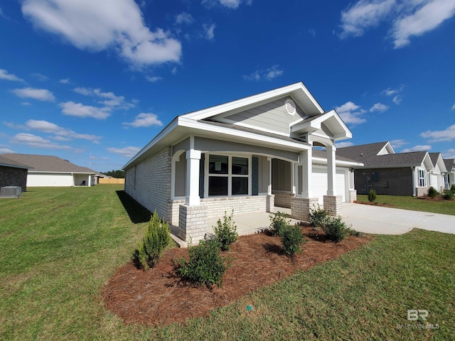 view of front of house with a garage and a front lawn